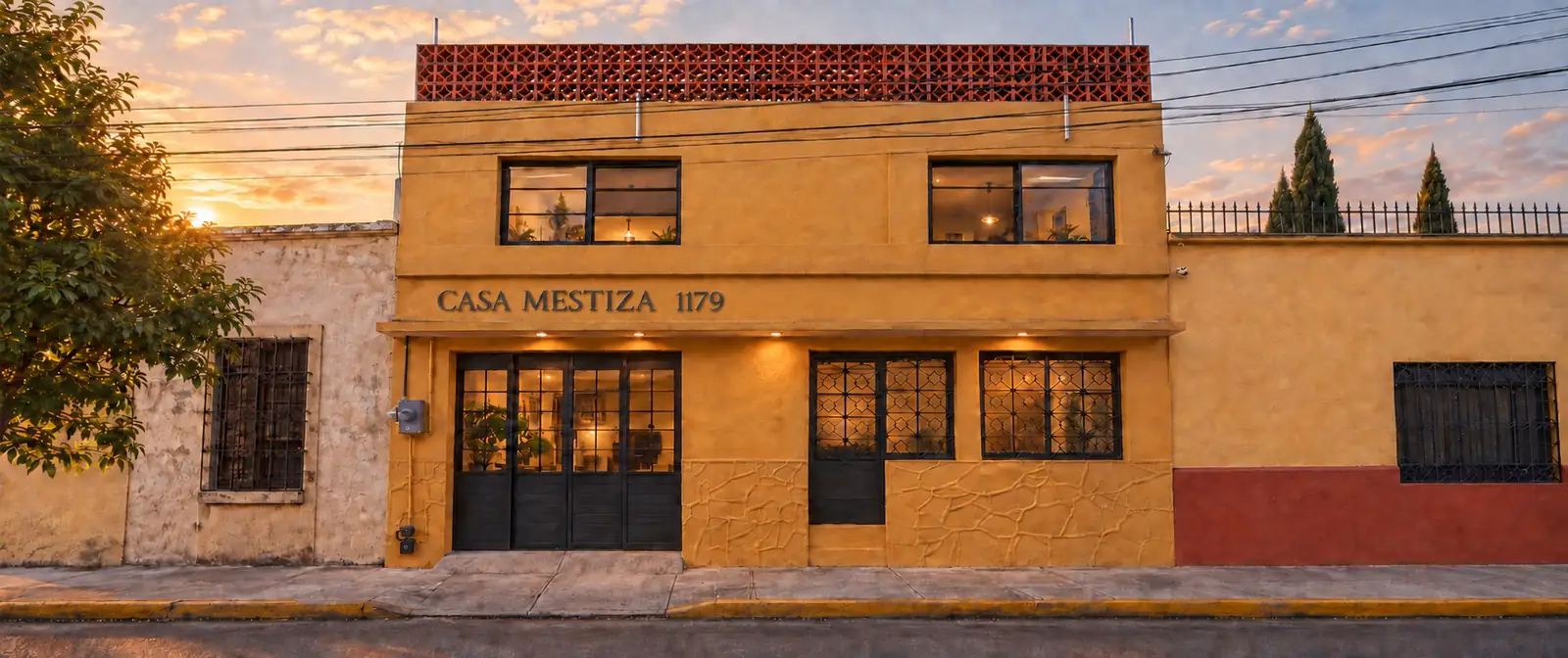 Vista frontal de Casa Mestiza al atardecer, imagen generada a partir de fotografías de referencia